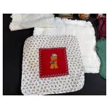 Holiday Decor and Linens Lot with Snowman Block Calendar, Santa Snow Globe, Tree Topper, and Doilies
