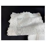 Holiday Decor and Linens Lot with Snowman Block Calendar, Santa Snow Globe, Tree Topper, and Doilies