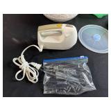 Kitchenware Collection with Ceramic Bowl, Plastic Colander, Hand Mixer, and Measuring Cups