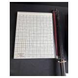 Assorted Office Supplies Including Paper Trimmer, Hanging File Folders, Ruler, and Coca-Cola Card Holder