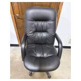Black Padded Office Chair with Armrests and Casters