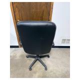 Black Padded Office Chair with Armrests and Casters