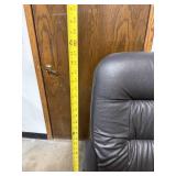 Black Padded Office Chair with Armrests and Casters