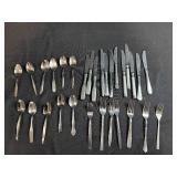 Assorted Stainless Steel Flatware Set Including Knives, Forks, and Spoons