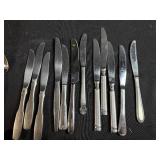 Assorted Stainless Steel Flatware Set Including Knives, Forks, and Spoons