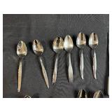 Assorted Stainless Steel Flatware Set Including Knives, Forks, and Spoons