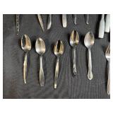 Assorted Stainless Steel Flatware Set Including Knives, Forks, and Spoons