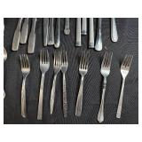 Assorted Stainless Steel Flatware Set Including Knives, Forks, and Spoons