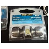 Household Hardware and Accessories Lot with Lock Sets, Bulbs, Fan, and Basket