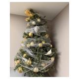 Table Top Decorated Artificial Christmas Tree with Ornaments and Bow Topper - wrapped for storage