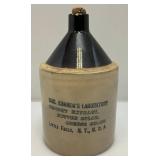 Vintage Primitive Items Including Small Oil Lamp, Whiskey Style Jug With Imprint And More