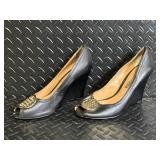 Audrey Brooke Black Leather Peep-Toe Wedge Heels - Gold Circular Medallion Toe Emblem