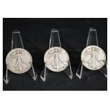 Three Walking Liberty Half Dollars (U.S. 1916-1947) on Display Stands