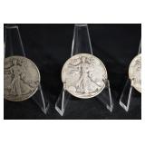 Three Walking Liberty Half Dollars (U.S. 1916-1947) on Display Stands