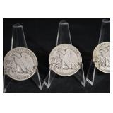 Three Walking Liberty Half Dollars (U.S. 1916-1947) on Display Stands