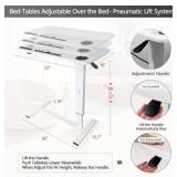 Adjustable overbed table for hospital or home. It has wheels and a USB port to charge your devices.