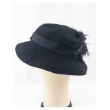 Black Felt Cloche Hat with Feather Accent & Gold Bow Clip