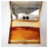 Vintage Gold-Tone Vanity Compact with Mirror, Amber-Toned Base, and Rhinestone Brooch