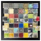 W - Collection of Assorted Glass Beads in Various Colors and Sizes
