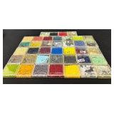 W - Collection of Assorted Glass Beads in Various Colors and Sizes
