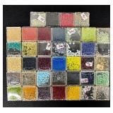 W - Collection of Assorted Glass Beads in Various Colors and Sizes