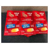 3 Display Cases Of Dolly Golden Creme Cakes