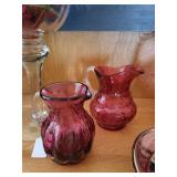 Set of 7 Cranberry Glass Pitchers, Basket, Bowls, and Hurricane Vases