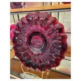 Collection of Red Art Glass Decor Pieces with Plates, Vases, and Candle Holder