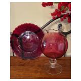 Collection of Red Art Glass Decor Pieces with Plates, Vases, and Candle Holder