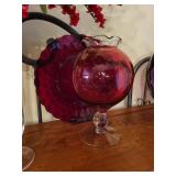 Collection of Red Art Glass Decor Pieces with Plates, Vases, and Candle Holder