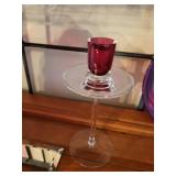 Collection of Red Art Glass Decor Pieces with Plates, Vases, and Candle Holder