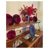 Collection of Red Art Glass Decor Pieces with Plates, Vases, and Candle Holder