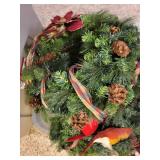 Collection of Holiday and Christmas Decor with Wreaths, Garlands, and Village Pieces