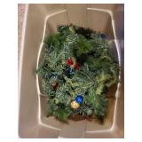 Collection of Holiday and Christmas Decor with Wreaths, Garlands, and Village Pieces