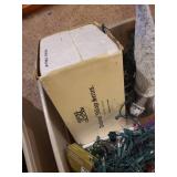 Collection of Holiday and Christmas Decor with Wreaths, Garlands, and Village Pieces