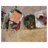 Collection of Holiday and Christmas Decor with Wreaths, Garlands, and Village Pieces