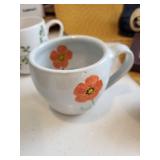 Kitchenware Collection with Coffee Mugs, Glass Bottle, Framed Quote, and Utensils