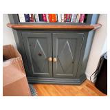 Green Corner Bookshelf with Wood Trim and Cabinet Doors