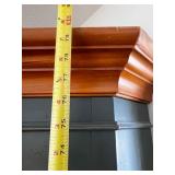 Green Corner Bookshelf with Wood Trim and Cabinet Doors