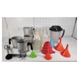 Assorted Wax and Soap Preparation Items including Aluminum Pitchers, Glass Bottles, and Funnels