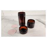 Amber Plastic Jars with Lids and Seals (not counted) - 45 of the 3" ones, 42 of the 6 1/2" ones, very few of the very short ones