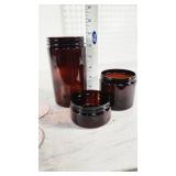 Amber Plastic Jars with Lids and Seals (not counted) - 45 of the 3" ones, 42 of the 6 1/2" ones, very few of the very short ones