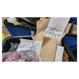 Decorative shreds, tissue paper and packing materials in a container