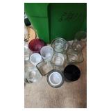 Collection of Used Glass Jars and Candle Holders