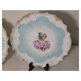 Pair of Antique Portrait Cabinet Plates with Gilt and Blue Fluted Wells