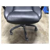 Black Faux Leather Office Chair with Adjustable Armrests and Casters