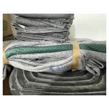 Group of Moving Blankets, Used U-Haul Boxes, and Packing Materials & Large Trash Bin