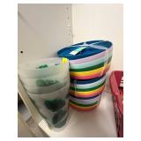 Tall White Storage Cabinet with Assorted Household Supplies