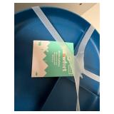 Tall White Storage Cabinet with Assorted Household Supplies