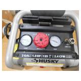 Husky 2 Gal. 135 PSI Portable Electric Oil-Free Quiet Jobsite Air Compressor with Dual Pressure Gauges and 1-Quick Coupler